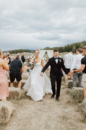 Married couple at a wedding venue in Lumby British Columbia walking down the aisle